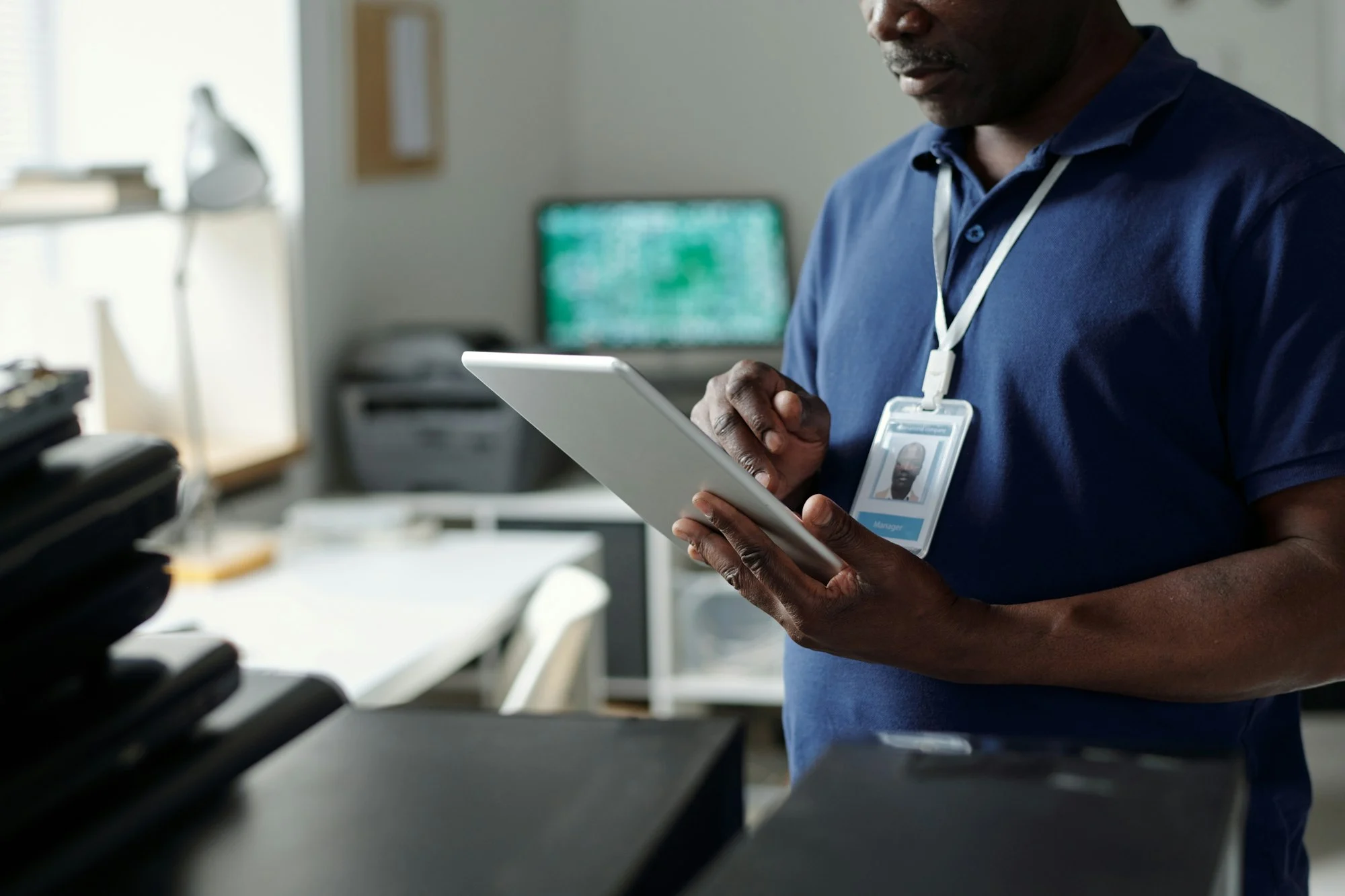 Engineer reading online manual in tablet